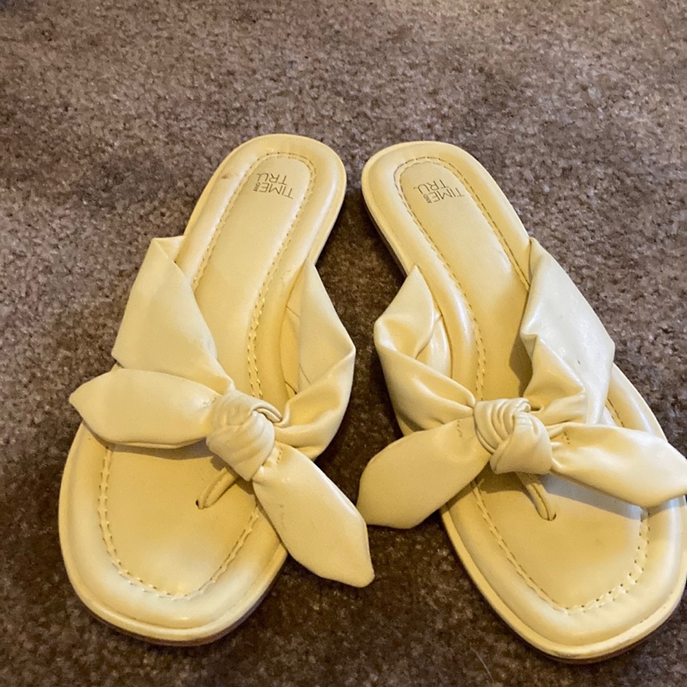 Yellow bow tie flip flops